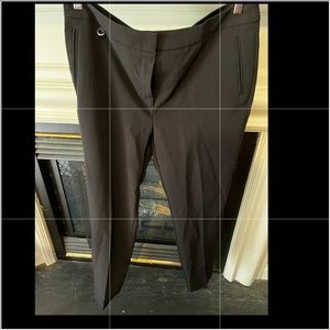 Essential black trousers, suit pants.